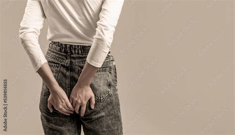 A Woman Holds His Hands To The Ass Feeling Pain Hemorrhoids Anus Ass Pain Woman Hand Holding