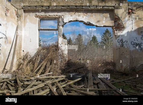 View From The Room Of An Abandoned House With A Broken Wall Showing