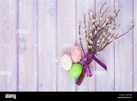 Pussy Willow And Easter Eggs Over Wooden Table Background With Copy