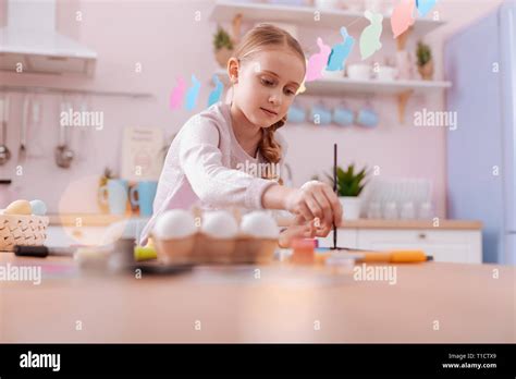 Attentive Blonde Girl Mixing Colors Before Painting Stock Photo Alamy