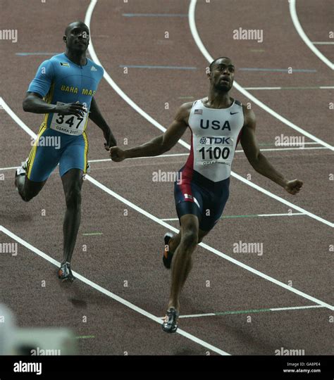 USA S Tyson Gay Celebrates Winning The Men S M From Bahamas Second Place Derrick Atkins