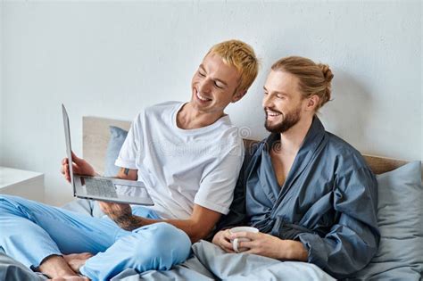 Joyful Gay Man Showing Laptop To Stock Photo Image Of Bedroom Connection 298678576