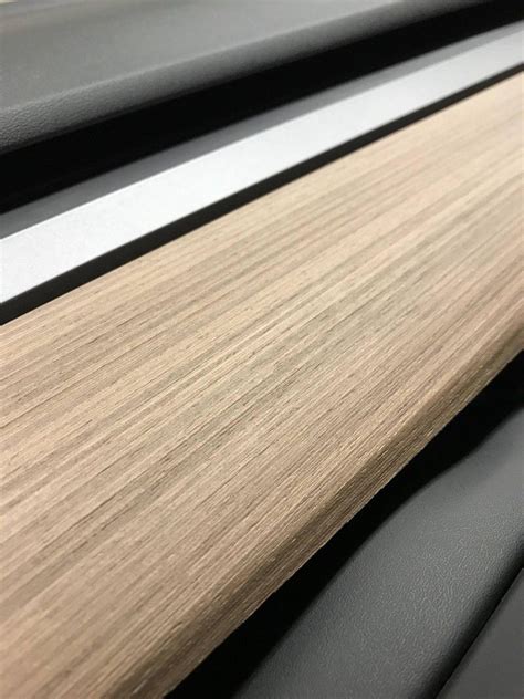 Luxurious Car Interior With Wood Grains And Black Leather Upholstery