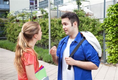 Two Students Talking on Campus Stock Photo - Image of couple, educate: 40148882