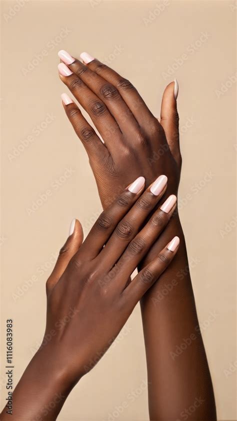 Vertical Close Up On Female Hands With Soft Touch Gesture Presenting Perfect Nude Manicure