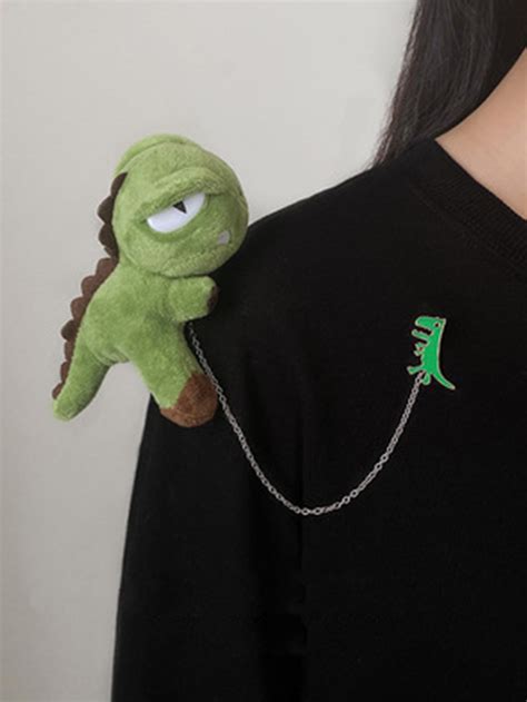 Брошь с узором динозавра