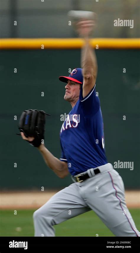 Texas Rangers Pitcher Cole Hamels Throws During Spring Training