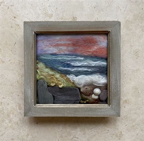 There Is A Painting On The Wall That Looks Like It Has Rocks And Shells