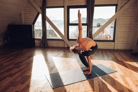 Premium Photo Senior Man With A Naked Torso Practicing Yoga Classic Asana Training In Studio