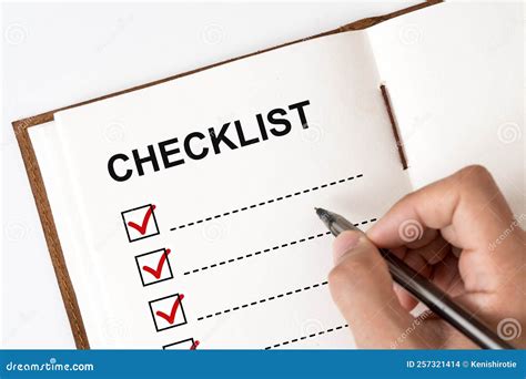 checklist marked red    stock photo image  holding list