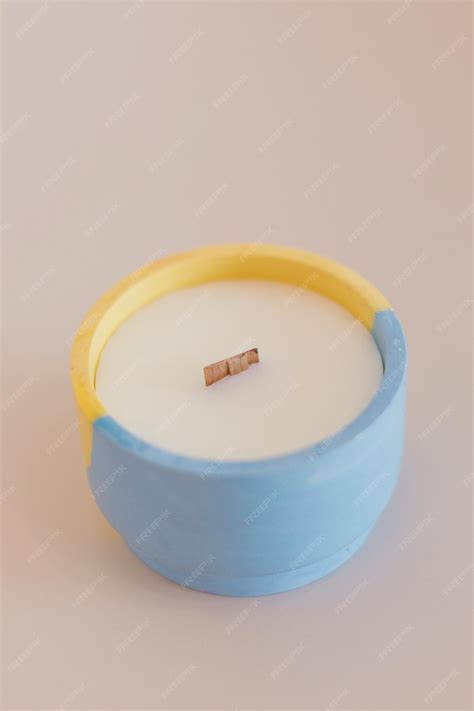 Premium Photo Candle In Concrete Form Light Background