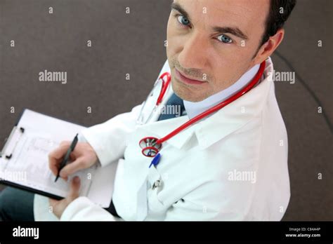 doctor writing   paper stock photo alamy