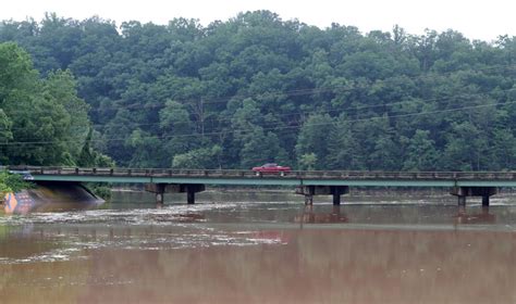 Police Body Found In Search For Motorists Swept Away By Floodwaters