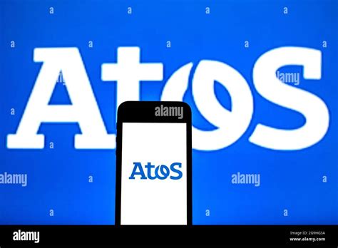 photo illustration  atos logo  displayed   smartphone