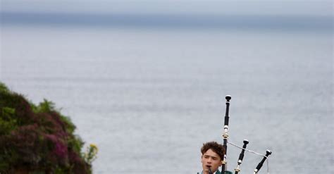 A Man In A Kilt Playing Bagpipes Near The Ocean · Free Stock Photo