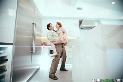 Pretty Redhead Babe Amber Addis Fucked By An Older Man In The Kitchen 11 Photos