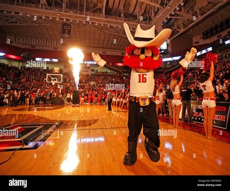 Texas Tech mascot Raider Red raises his arms in the air as the starting ...