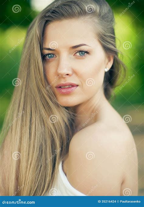 Portrait Of Beautiful Young Girl With Clean Skin On Pretty Face Stock