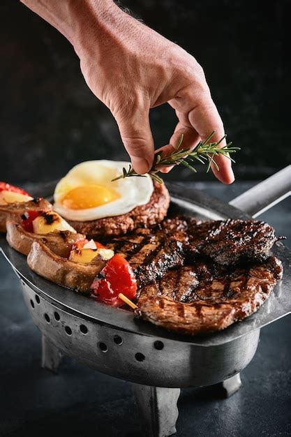 Premium Photo | Grilled meat platter. assorted delicious grilled meat ...