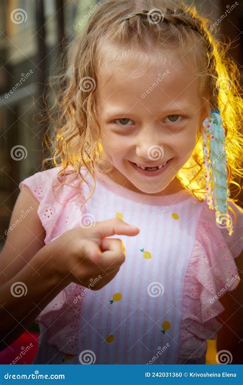 Portrait Of Funny Caucasian Cute Pretty Blonde Girl In The Summer In The Summer Day Near The