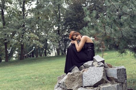 Slender Brunette In A Black Dress In The Park Stock Photo Image Of Outdoor Cute