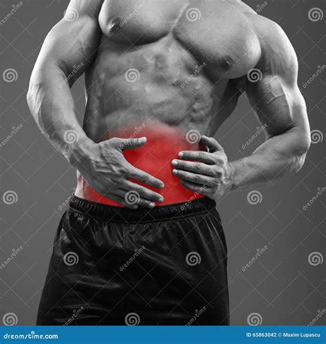 Muscular Man Pain In Left Side Of Abdomen Royalty-Free Stock Image