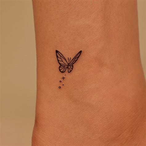 Minimalistic Butterfly Tattoo Located On The Ankle