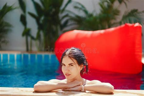 Brunette Girl Relaxing In The Pool Stock Photo Image Of Recreation Brunette