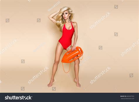 Sexy Busty Blonde Lifeguard Woman Red Stock Photo 669307552 Shutterstock