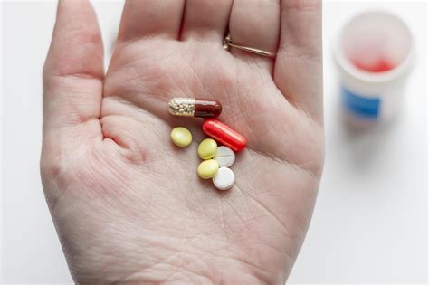 medicine pills in woman hand 9995436 Stock Photo at Vecteezy