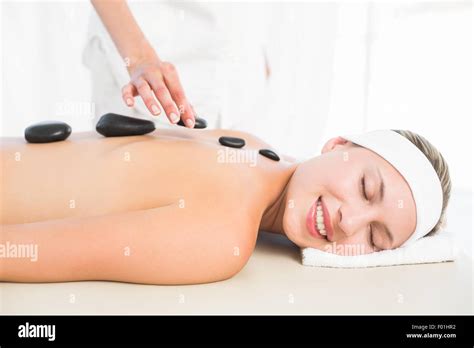 Beautiful Blonde Enjoying A Hot Stone Massage Stock Photo Alamy