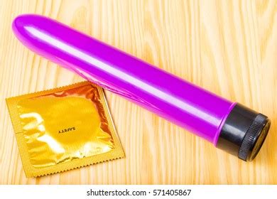 Purple Sex Toy Condom On Table Stock Photo Shutterstock