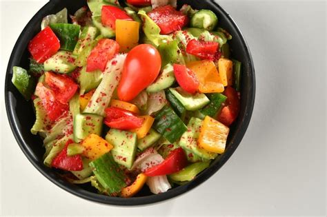 Premium Photo | Green vegan salad from green leaves mix and vegetables.