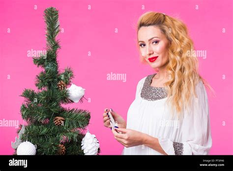 Christmas And Holiday Concept Portrait Of Smiling Beautiful Blonde Woman With Christmas Tree