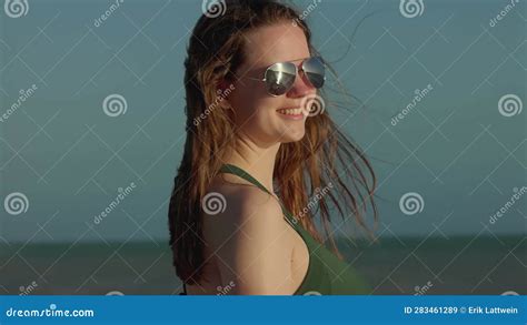 Beautiful Girl Wearing A Bikini At Miami Beach On A Windy Day In Slow