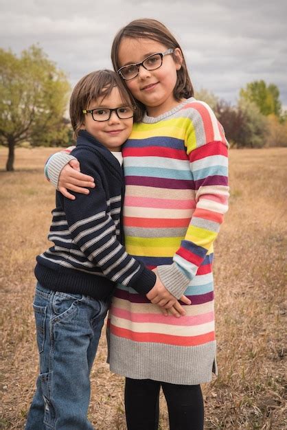 Premium Photo Portrait Of Brother And Sister Standing Outdoors