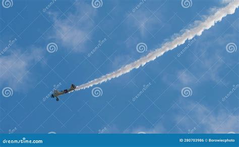 A Small Biplane Airplane Doing Acrobatic Stunts Against the Blue Sky Editorial Photo - Image of ...