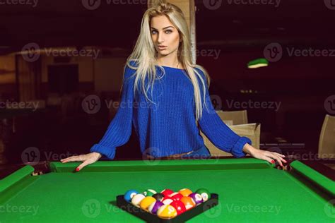 Lovely Adult Blonde Posing Near A Billiard Table With A Pyramid Of Balls Stock Photo At