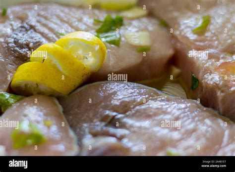 Marinated Swordfish In A Bowl With Lemon Oil Garlic Parsley Stock