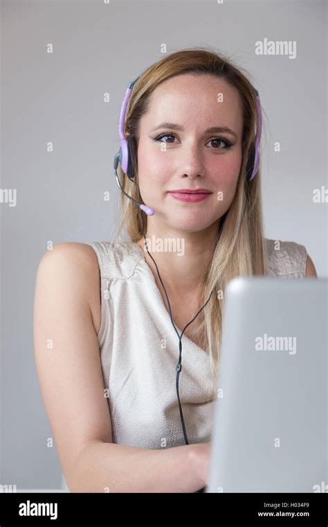 Portrait Of Attractive Blonde Woman With Headset Stock Photo Alamy