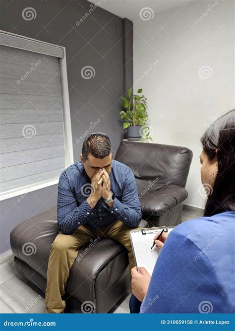 Latina Female Psychologist Listens To Her Dark Skinned Male Patient As He Tells In Therapy About
