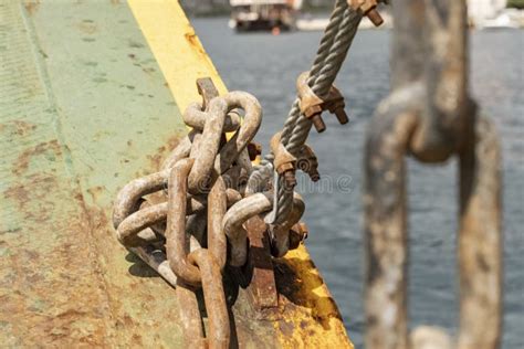 Close Up Of Metal Chains Rusty From Salt Water Attached To A Fishing