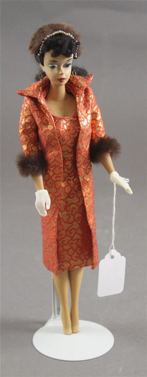 Lot BRUNETTE PONYTAIL BARBIE DOLL IS DRESSED IN GOLDEN ELEGANCE