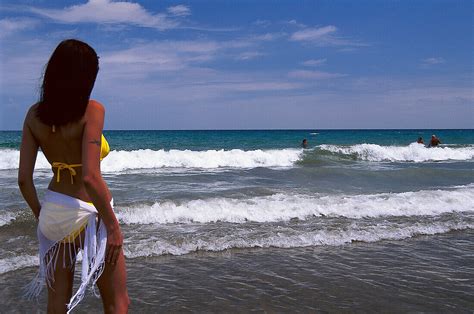 Woman In A Bikini Watching The Surf License Image