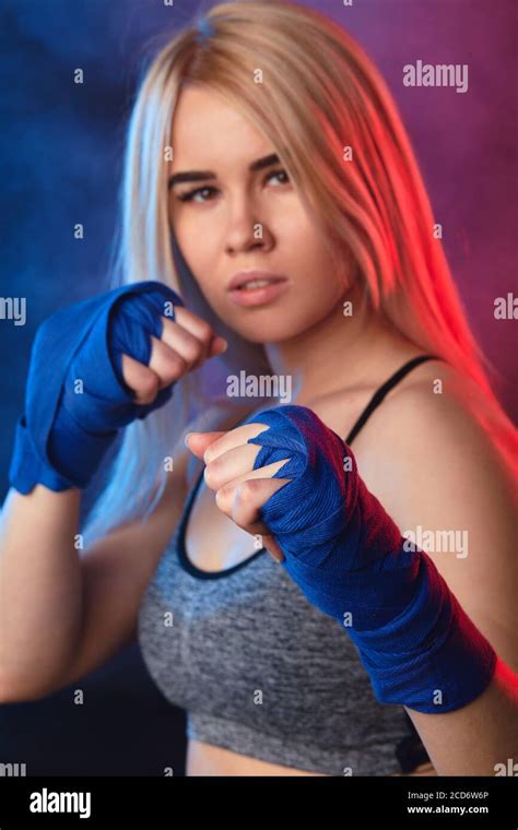 Close Up Face Portrait Of Attractive Blonde Woman Fighter In Boxing Bandages Posing In Defense