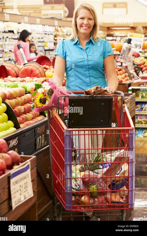 Woman Pushing Shopping Trolley Hi Res Stock Photography And Images Alamy