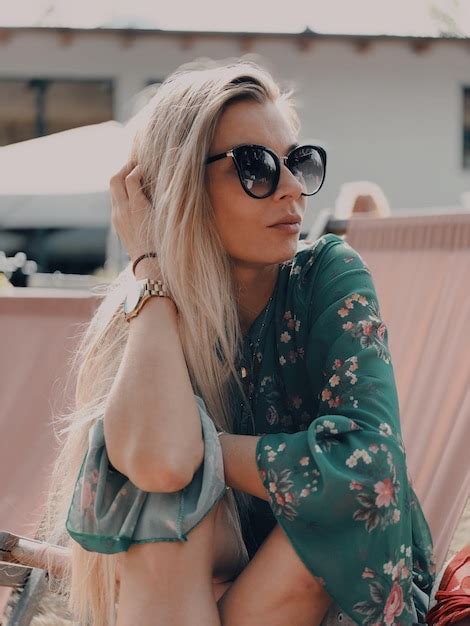 Premium Photo Fashionable Woman Wearing Sunglasses Looking Away Outdoors