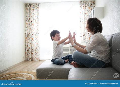 Beautiful Brunette Mom And Son Hugging Sofa Stock Photo Image Of Communication Concept 122789594