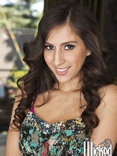 The Lusty Brunette April ONeil Taking Off Dress And Sexily Playing With Lingerie Uncovering Nudity