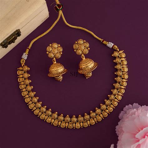 gold finish flower design necklace  matching jhumkas south india